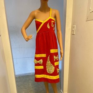 A red dress with pieces of authentic bandanna on it made of cotton